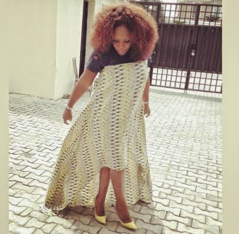 5 Photo: Omawumi and her growing baby bump step out