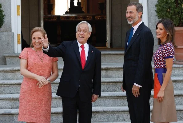 Queen Letizia wore Hugo Boss Seplea colorblock leather skirt, Boss Felisabeth Short sleeved sweater. President Sebastian Pinera and Cecilia Morel