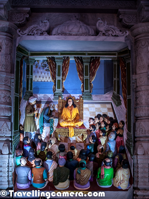 Few days back we shared a Photo Journey about Prem Mandir in Vrindavan. Prem Mandir is really a beautiful place in vrindavan and looks more like a tourist spot rather than a spiritual place, which doesn't mean that temple has less spiritual value. Prem Mandir is one of the most popular temples in Virndavan and this Photo Journey will show it's interiors.Here is a photograph of Prem Mandir in vrindavan with huge lawns all around and colorful spaces, which are well maintained. Above photograph shows a man working in lush green lawn and trying to ensure that plants are in good shape.This is how various statues are carved in various marble pillars and Walls of Prem Mandir in Vrindavan. From a distance, most of them look real and specially the ones with lot of people in one creation having 3D effect because of different placementsLord Krishna, who takes the main place inside Prem Temple of Vrindavan. This Statue of Lord Krishna is just in front of main gate of Prem Mandir...  This whole area looks amazing with wonderful lighting all around !!Here is a view of Lord Krishna and Radha-Rani statues from main entry gate of Prem Mandir !!! Inside the temple, paths are properly marked which guide everyone about the way they need to follow to have peaceful darshan of Lord Krishna/Radha on ground floor and Shri Ram/Sita on upper floor of the templeA closer look at the statues of Lord Krishna and Radha Rani with lot of people standing in front of them !Here is one of the marvelous creation carved out of marble rocks and looks real from distance. Each portion in these creations is placed very well to have 3D perspective from longer distances. This photograph is shot with a zoom lens otherwise it's not allowed to go closer to these creation, jut to maintain disciplineEach and every portion of Prem Temple at Vrindavan is quite vibrant and colorful. The whole campus is designed very well and maintained with same spiritHere is a photograph clicked from first floor, showing people sitting on ground floor and enjoying spiritual music at Prem Mandir of Vridnavan !!This one is most popular stuff of Prem Temple. During morning ride in Auto, we kept hearing about this only... Something very glittery, colorful and a portion of it keeps rotating..There wea some interesting lighting stuff inside the Prem Temple. 