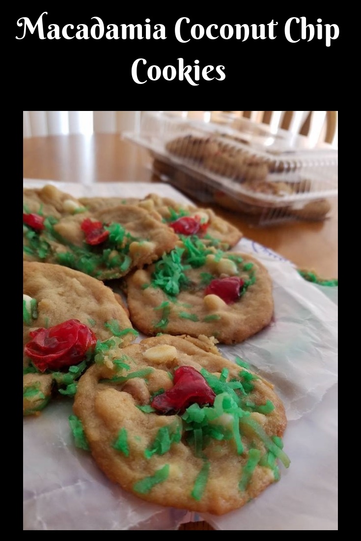 these are a festive macadamia nut green coconut topped cookie with cherries on top with the elf on the shelf female doll in the photo along with pine cone centerpiece. for the Christmas cooking tray and baking holiday season