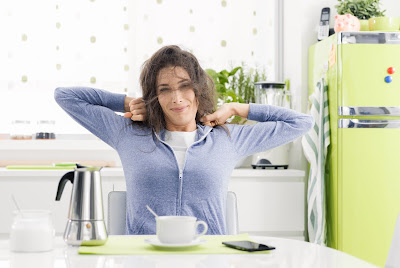 woman stretching after waking up in the morning