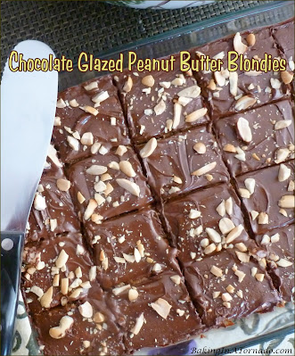 Chocolate Glazed Peanut Butter Blondies satisfy any sweet tooth. Dense peanut butter blondies are topped with a chocolate glaze and chopped peanuts. | Recipe developed by www.BakingInATornado.com