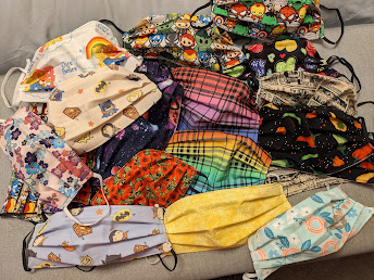 Many face masks that I have sewn from patterned fabric including:  Rainbow plaid, Avengers, Care Bears, Marvel Superheroes, Legend of Zelda, Hot Peppers, Hearts, Outer Space, Poppies, Hedgehogs, Dragonflies, and Flowers