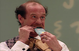 Mr Noodle puts a tube of toothpaste into his mouth. Sesame Street Elmo's World Teeth The Noodle Family