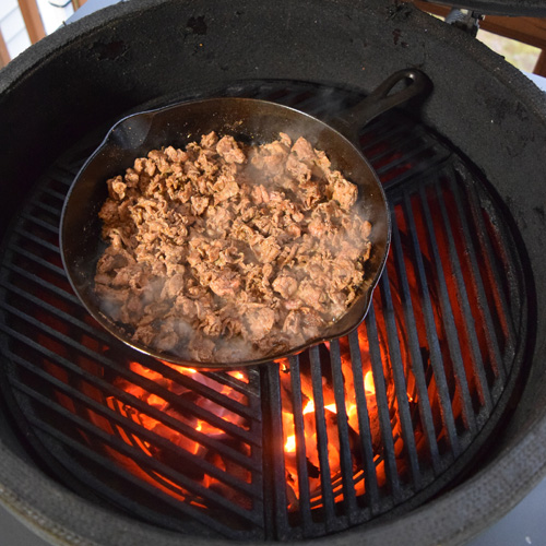 cooking Shaved steak gyros in a Griswold skillet on a Big Green Egg