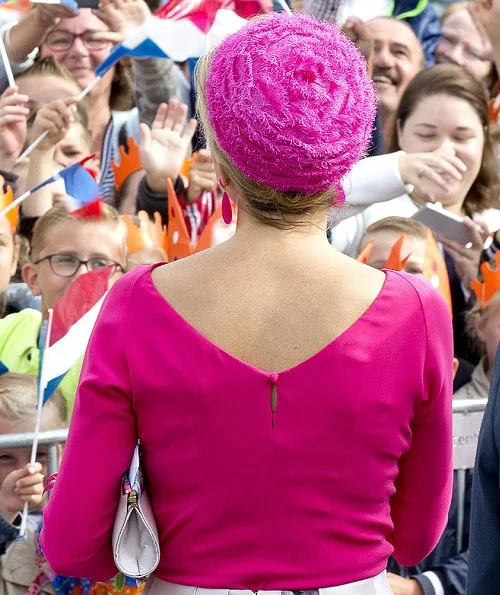 Dutch Queen Maxima wore Natan floral print skirt, Natan floral clutch bag, Natan fuchsia shoes and Natan fuchsia top