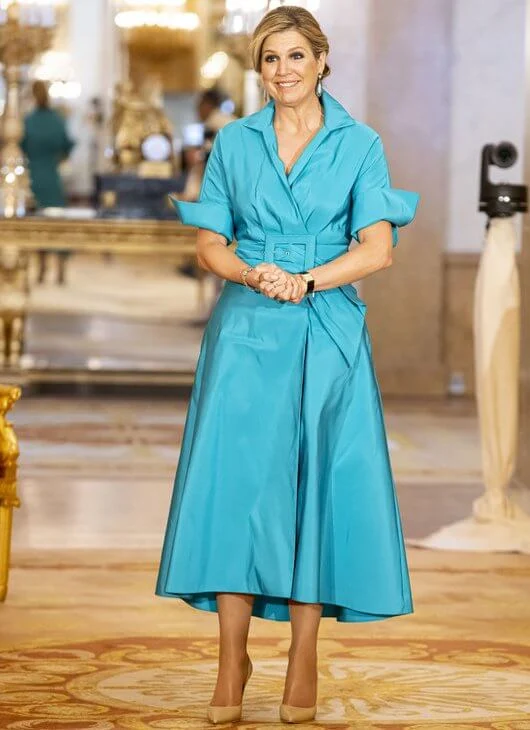 Queen Maxima wore a new blue Taffeta shirt dress from Natan, blue diamond earrings