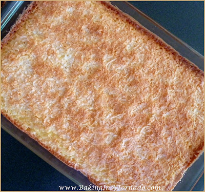 Chewy Orange Pineapple Bars: Ooey Gooey Orange Pineapple flavored bars in a shortbread crust with a crunchy toasted coconut topping | Recipe developed by www.BakingInATornado.com | #recipe #dessert 