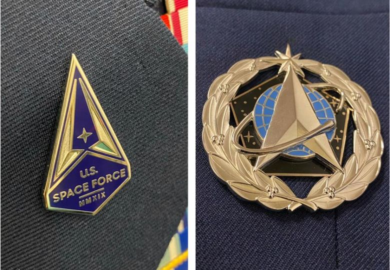 Space Force troops get lapel pin and badge to wear on their Air Force uniforms for now