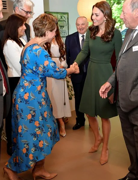 Kate Middleton in a custom forest green Emilia Wickstead dress, Mulberry bag and Gianvito Rossi heels