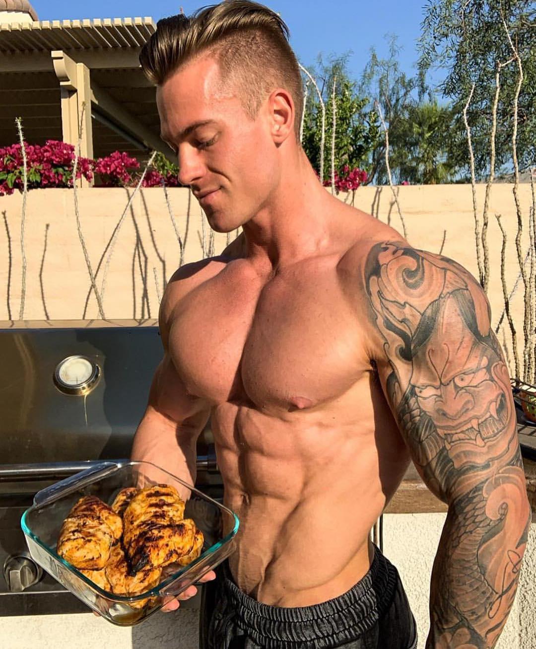 hot-shirtless-muscle-hunk-eating-meat-arm-tattoo