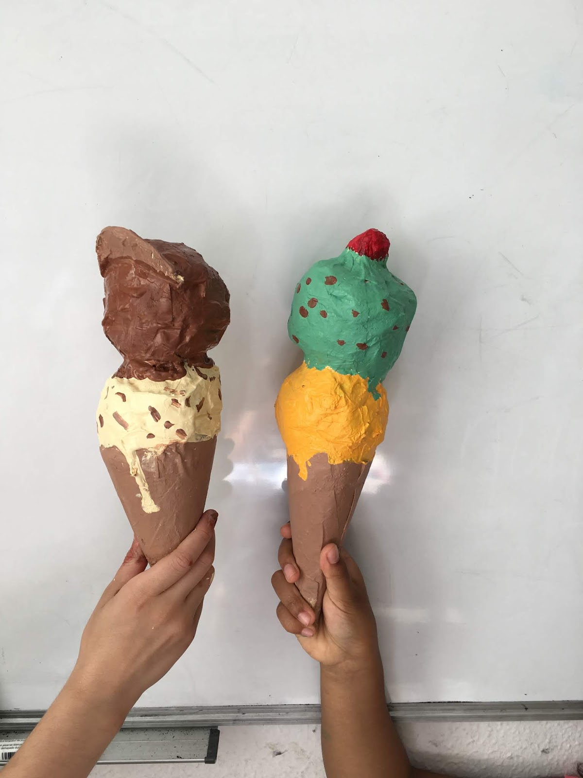 Paper mache ice cream cones made by kids. - ARTBAR
