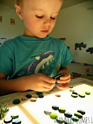 J examining the glass stones of the frog pond from And Next Comes L