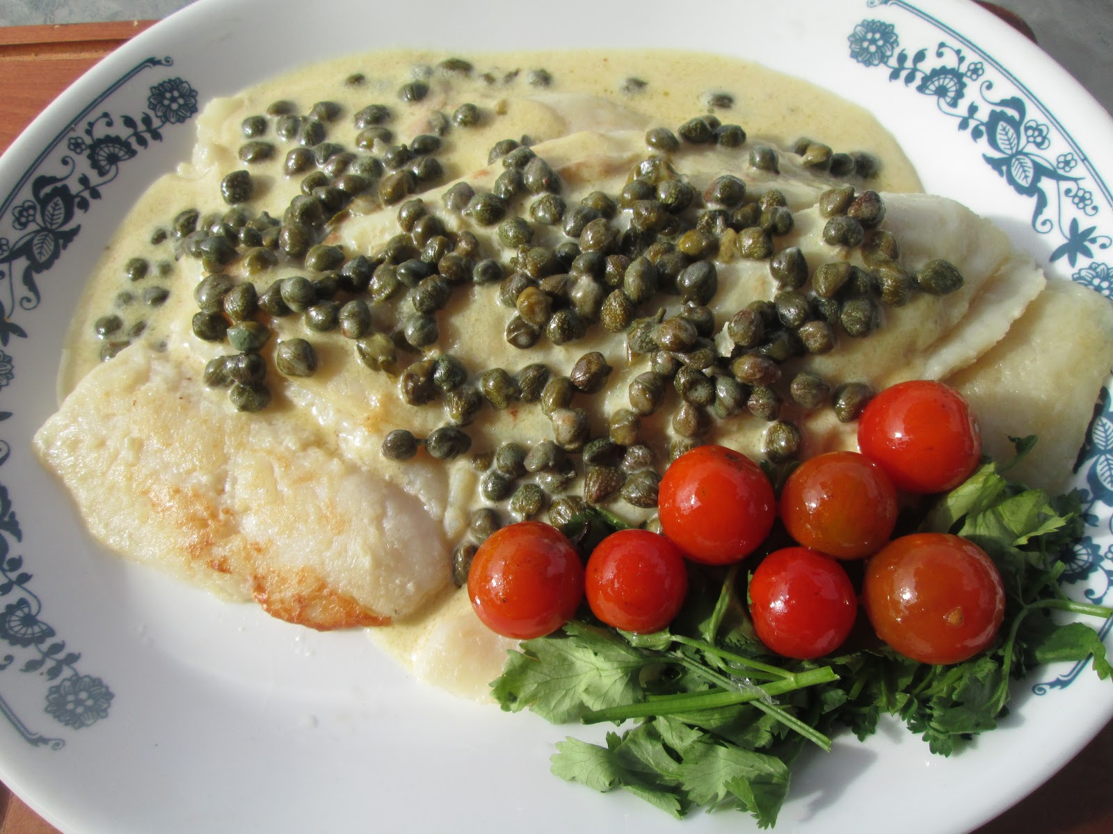 Canela kitchen (gloria): Fish with capers sauce and cherry tomatoes