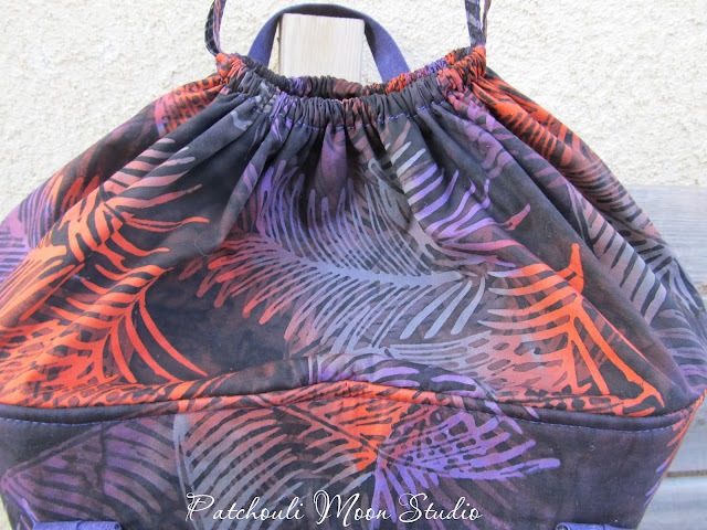 Patchouli Moon Studio~ Round Tote Bag with Drawstring Top, Handles & Pockets Closer view of the bag and the drawstring closure while closed
