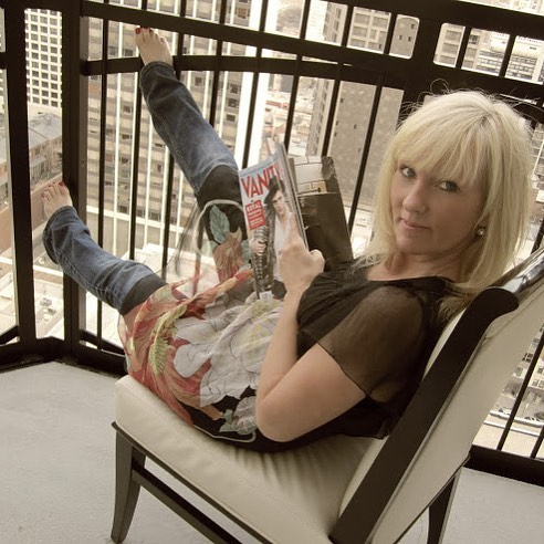 Blonde seated on iron balcony Waldorf Chicago by Hello Lovely Studio