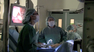 Doctors performing minimally invasive surgery