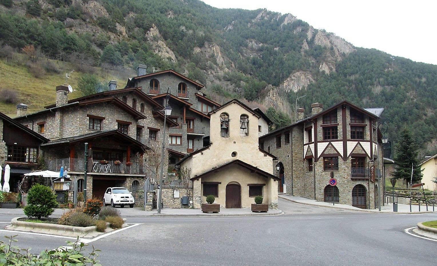 Modern stone houses in front of mountains