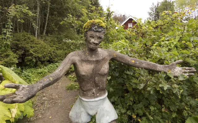Statue with arms outstretched as if to give a hug at Parikkala Sculpture Park