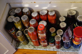 image of a pantry shelf filled with jars of home-canned goods.