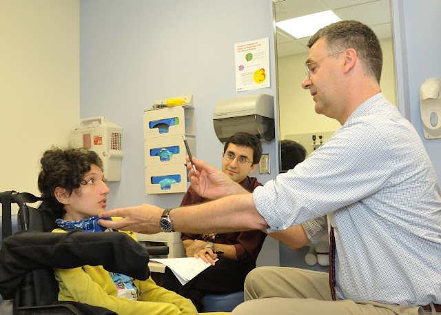 Dr. Bönnemann examines Claudia Digregorio, a childhood ALS patient from the Apulia region of Italy. (Photo courtesy of NIH/NINDS).