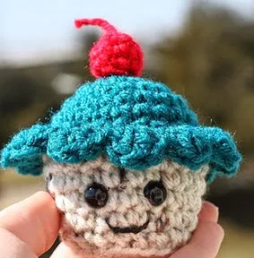 http://www.craftleftovers.com/patterns/cupcakemoscot.pdf