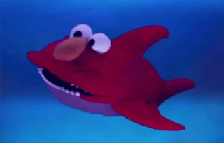 Dorothy imagines Elmo as a shark. Sesame Street Elmo's World Teeth Tickle Me Land