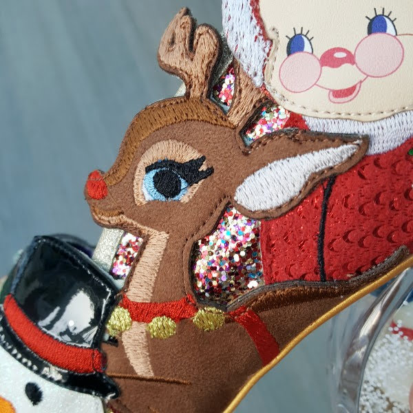 close up of applique Rudolph reindeer on side of shoe