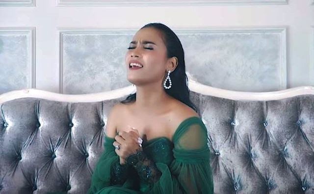 Lirik Lagu Na Olo Do Au dan Artinya Maria Calista