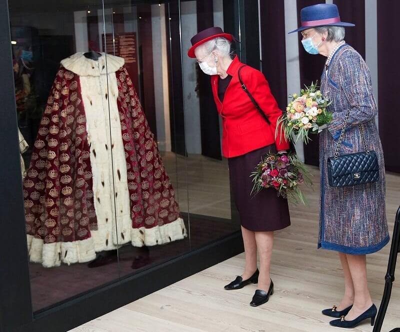 Queen Margrethe and Princess Benedikte visited the Queen's Embroideries exhibition. Red blazer and printed wool coat