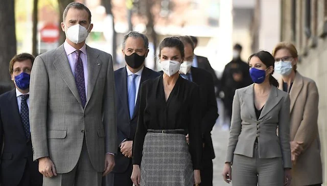 Queen Letizia wore a black v-neck silk shirt from Sandro, and pointed-check wool skirt from Massimo Dutti