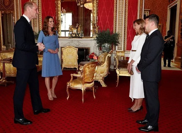 Kate Middleton wore a blue v-neck belted bespoke dress from Emilia Wickstead, and her praline Gianvito Rossi pumps. First Lady Olena Zelenska