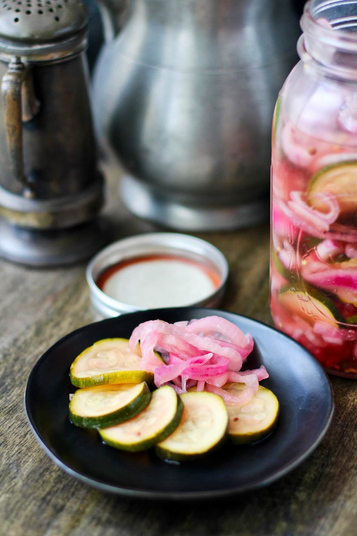Quick Pickled Zucchini and Red Onions plated and in a jar.