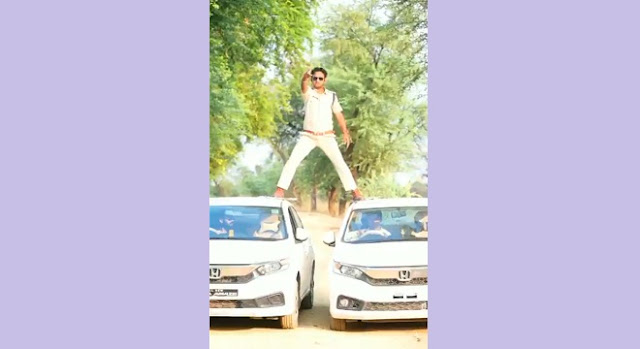 police sub inspector pulls off singham stunt by balancing on two cars