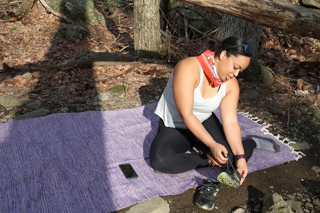 Black yogi taking a break from hiking