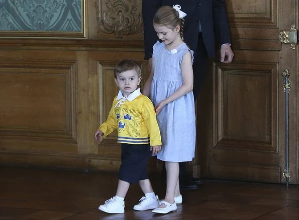 Crown Princess Victoria wore Oscar De La Renta Floral Print Dress, Yves Saint Laurent Suede Pumps, carries Quidam Clutch. Princess Estelle, Prince Oscar