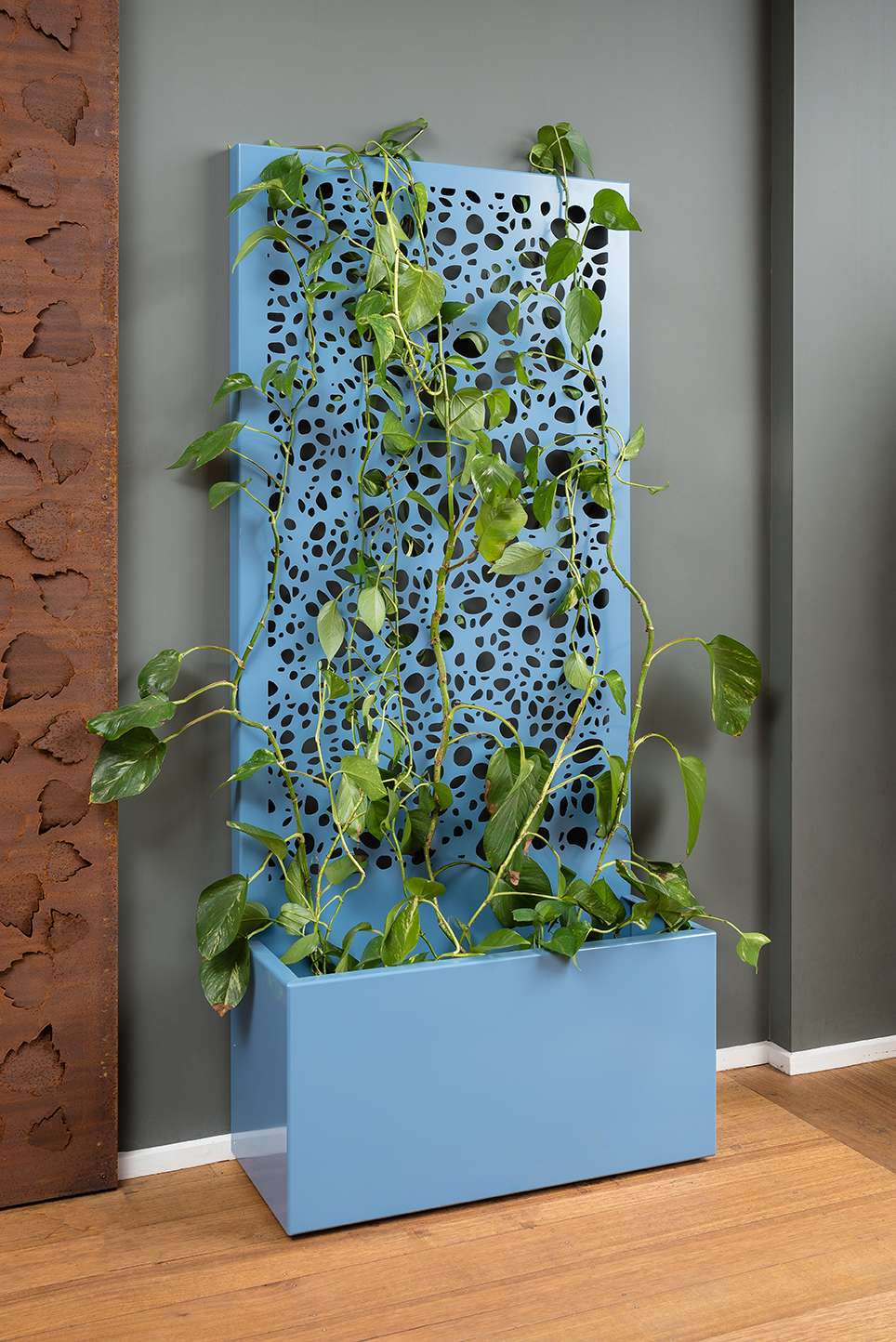 A freestanding screen offering privacy and a generous planter for your