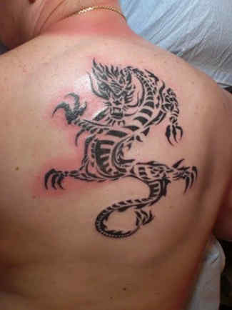 Tribal Dragon Back Tattoo