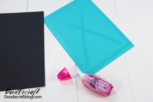 Step 1: Background Begin by cutting the black cardstock into 5×7 inches. Trim the turquoise paper 1/8 inch smaller on each side than the 5×7 inches. Then, use the Tombow Permanent Adhesive to secure them together.
