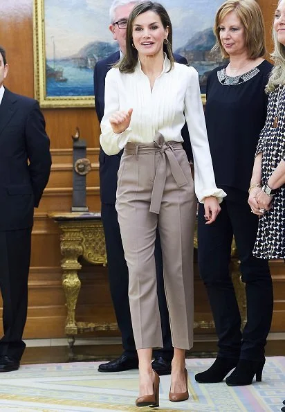 Queen Letizia wore camel Hugo Boss block-heel pumps, silky billow sleeve blouse and Atelier Swarovski Kalix Double Stud Pierced Earrings