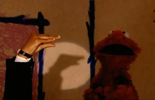 a hand can do a shadow duck or snapping fingers. Sesame Street Elmo's World Hands Interview