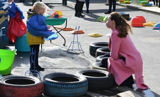 Kate Middleton wore a pink pure wool coat from Max & Co, and a pink scallop jumper from Boden