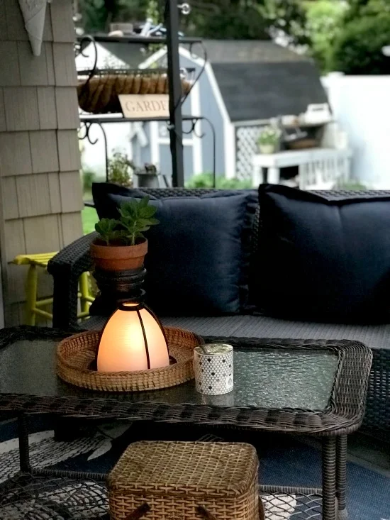 lit candle lantern on table