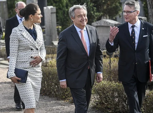 Crown Princess Victoria carried Quidam Clutch, wore Gant Vertical Striped Bow Blouse, and Alexander McQueen double-breasted printed blazer and skirt