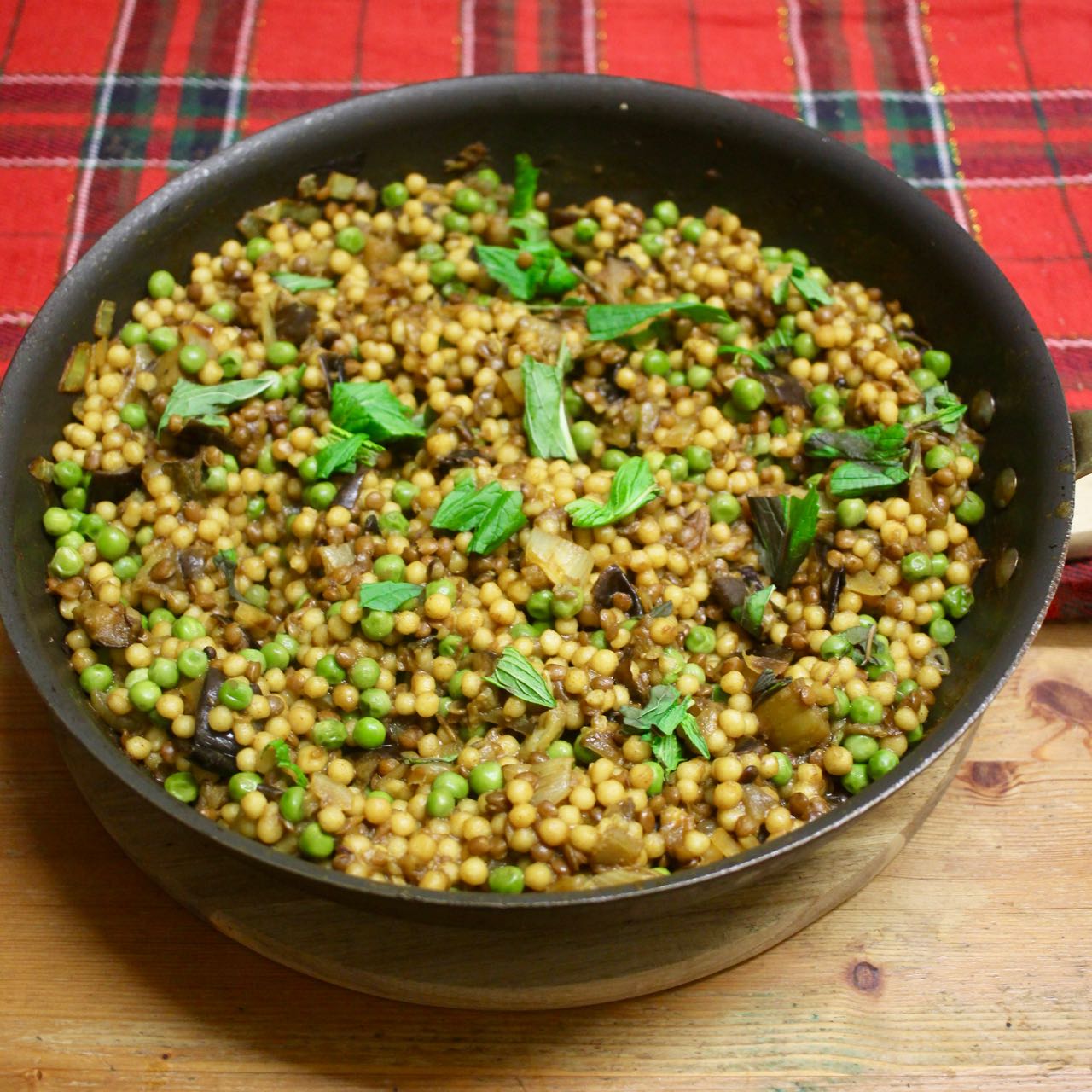 Green Gourmet Giraffe Pearl couscous pilaf with eggplant, lentils and peas
