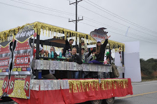 Mardi Gras float decorated with slot machine posters