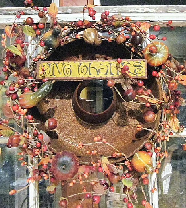 rusty thanksgiving wreath with give thanks sign