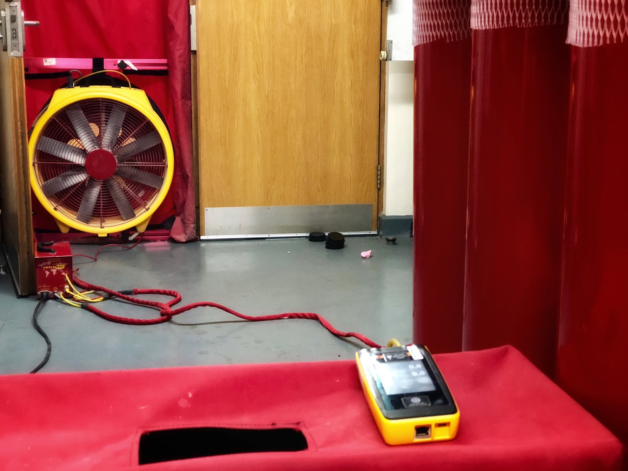 Room Integrity Test Smoke Testing to Highlight Air Leakage Paths in Protected Enclosures