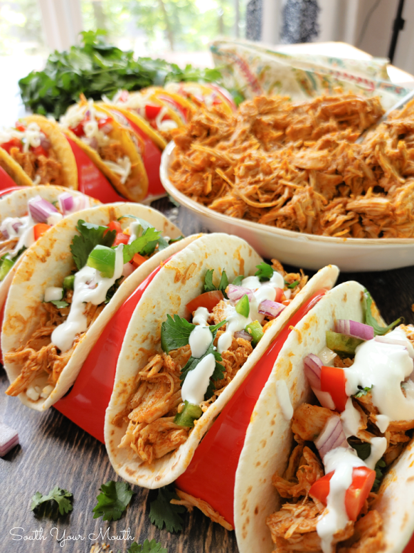 3-Ingredient Crock Pot Chicken Tacos! A super simple slow cooker recipe for shredded Mexican chicken taco meat made with chicken breasts perfect for tacos, burritos, rice bowls and more made with only three ingredients.