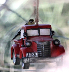 Red truck bird feeder - photo by Janice East